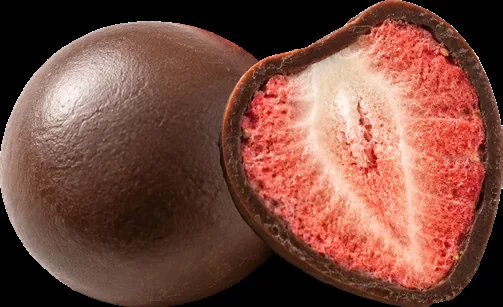 Freeze-dried strawberry in dark chocolate, cut open to show the fruit